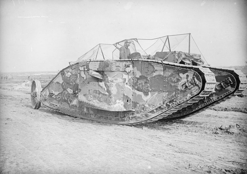 The first official photograph of a tank going into action. Battle of Flers-Courcelette, 15 September 1916.